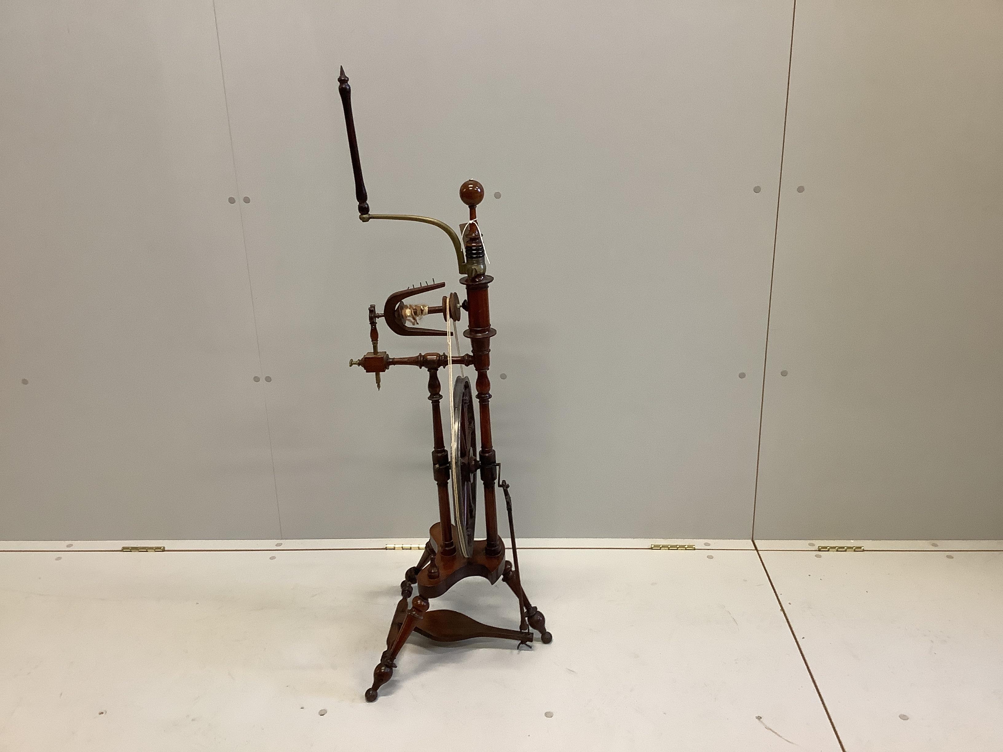 A 19th century lead and brass mounted turned mahogany spinning wheel, height 118cm